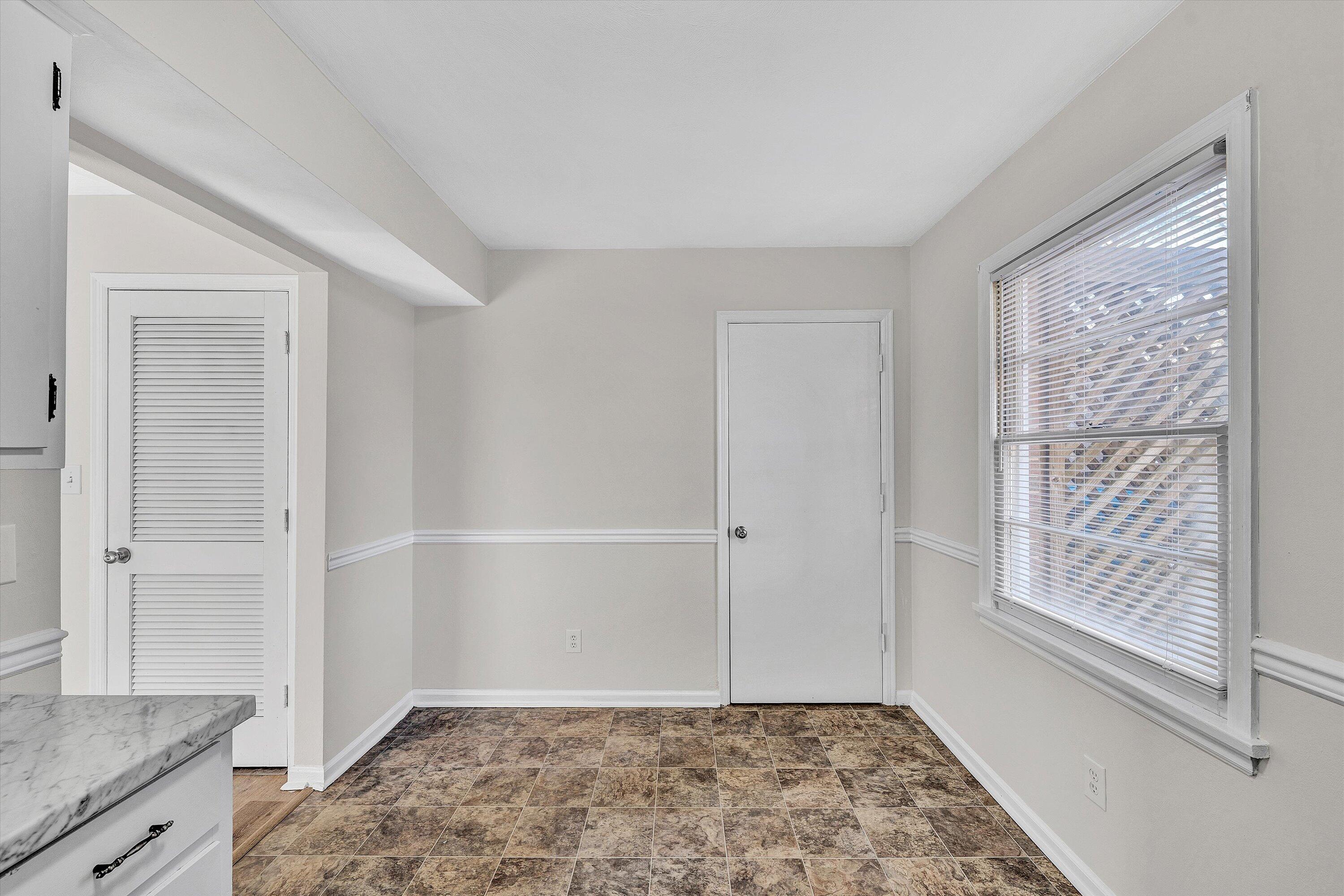 4524 Ohio Street Northeast, Unit 4528 Roanoke, VA 24019 - Photo 13 of 28 a view of an empty room with window and wooden floor