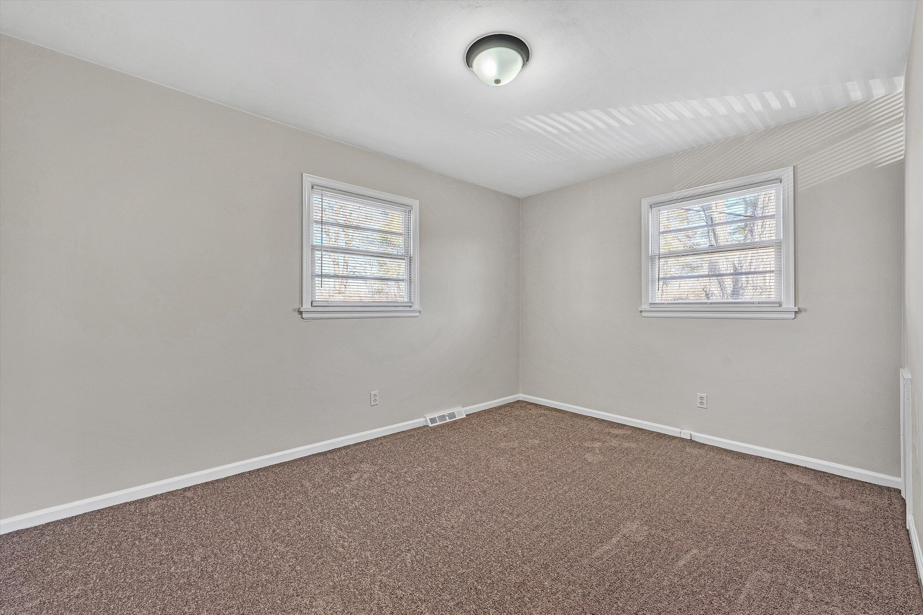4524 Ohio Street Northeast, Unit 4528 Roanoke, VA 24019 - Photo 14 of 28 an empty room with windows