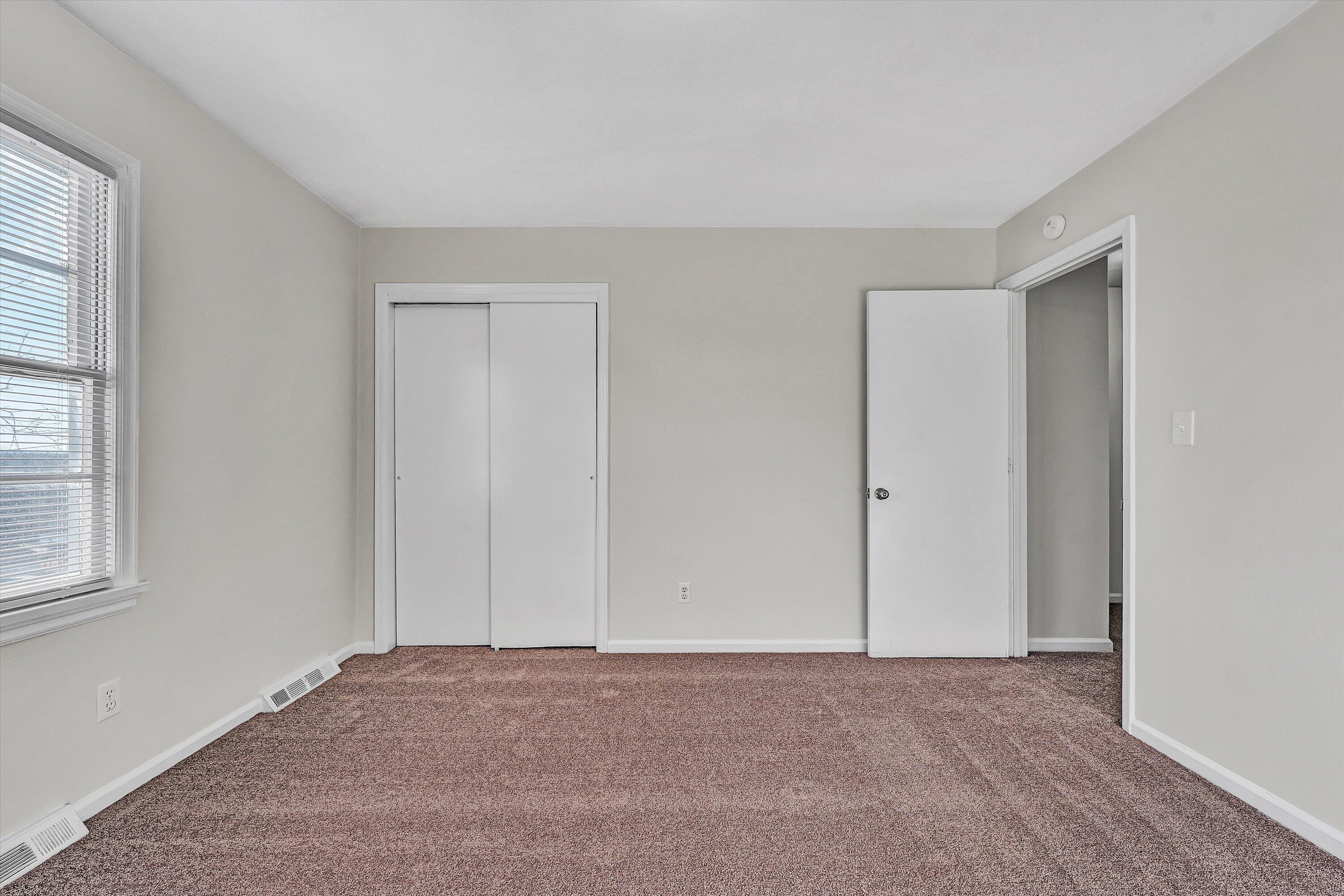 4524 Ohio Street Northeast, Unit 4528 Roanoke, VA 24019 - Photo 18 of 28 a view of an empty room and a window