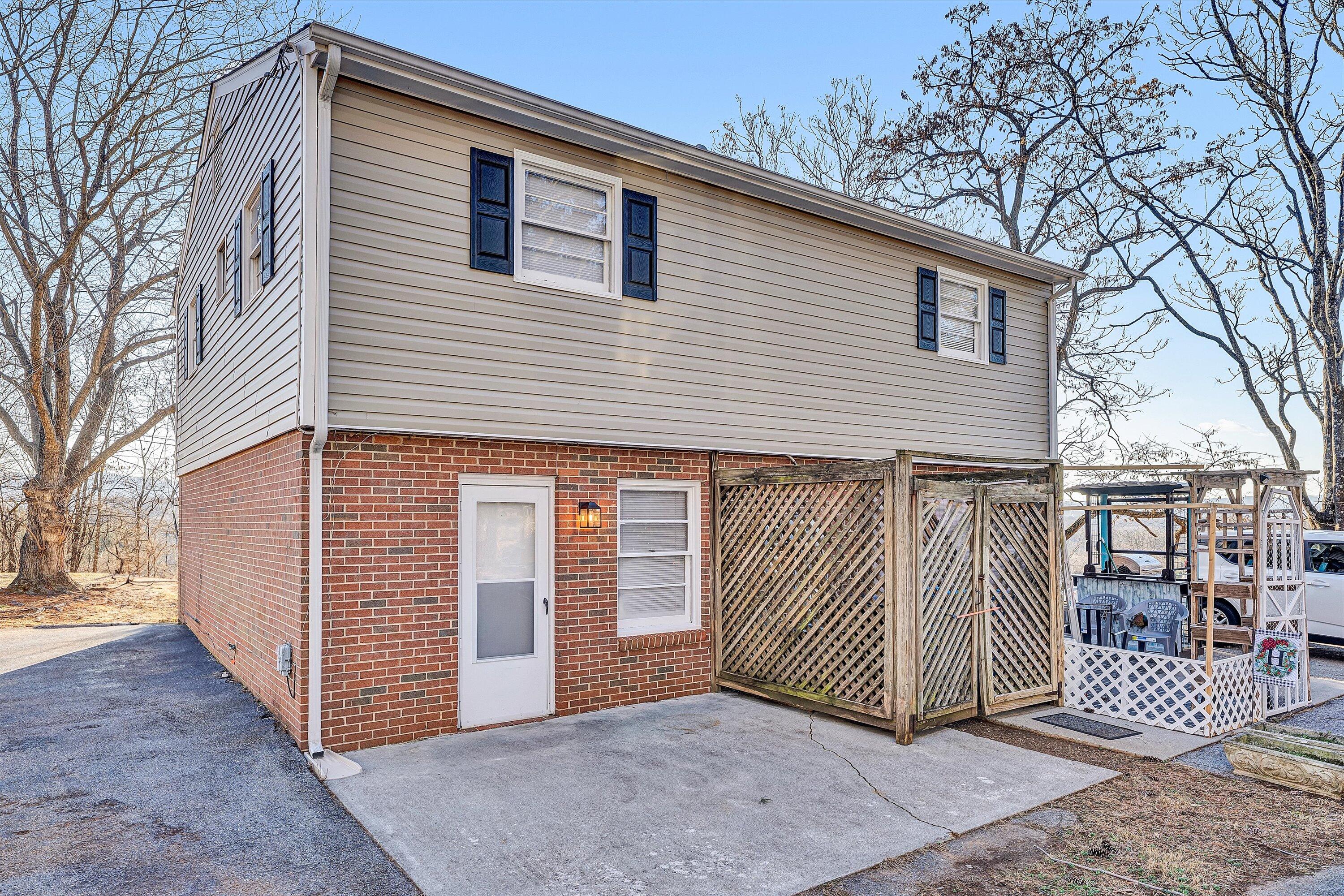 4524 Ohio Street Northeast, Unit 4528 Roanoke, VA 24019 - Photo 19 of 28 a view of a house with a backyard and wooden fence