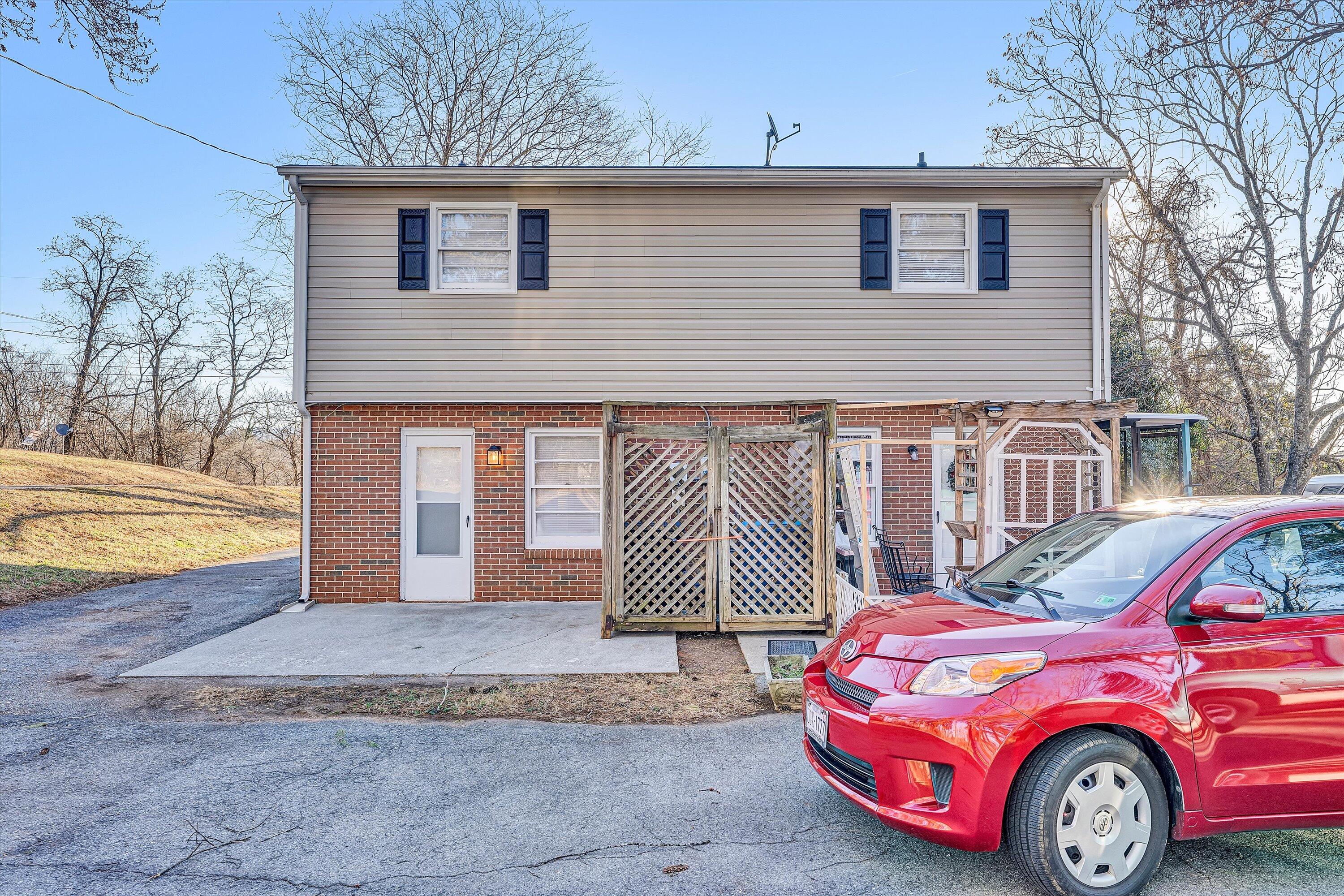 4524 Ohio Street Northeast, Unit 4528 Roanoke, VA 24019 - Photo 20 of 28 a front view of a house with a garden and parking space