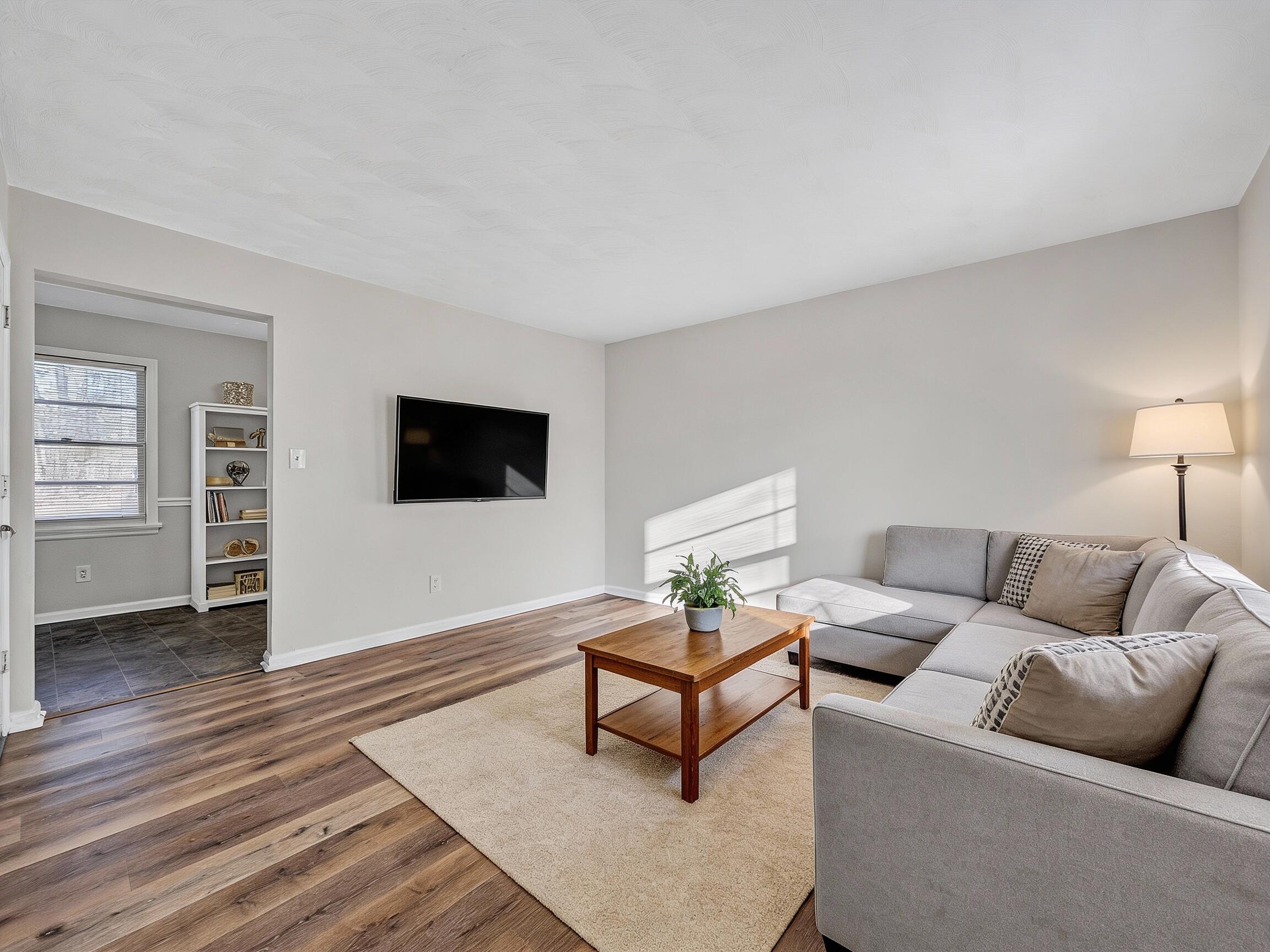 4524 Ohio Street Northeast, Unit 4528 Roanoke, VA 24019 - Photo 28 of 28 a living room with furniture and a flat screen tv