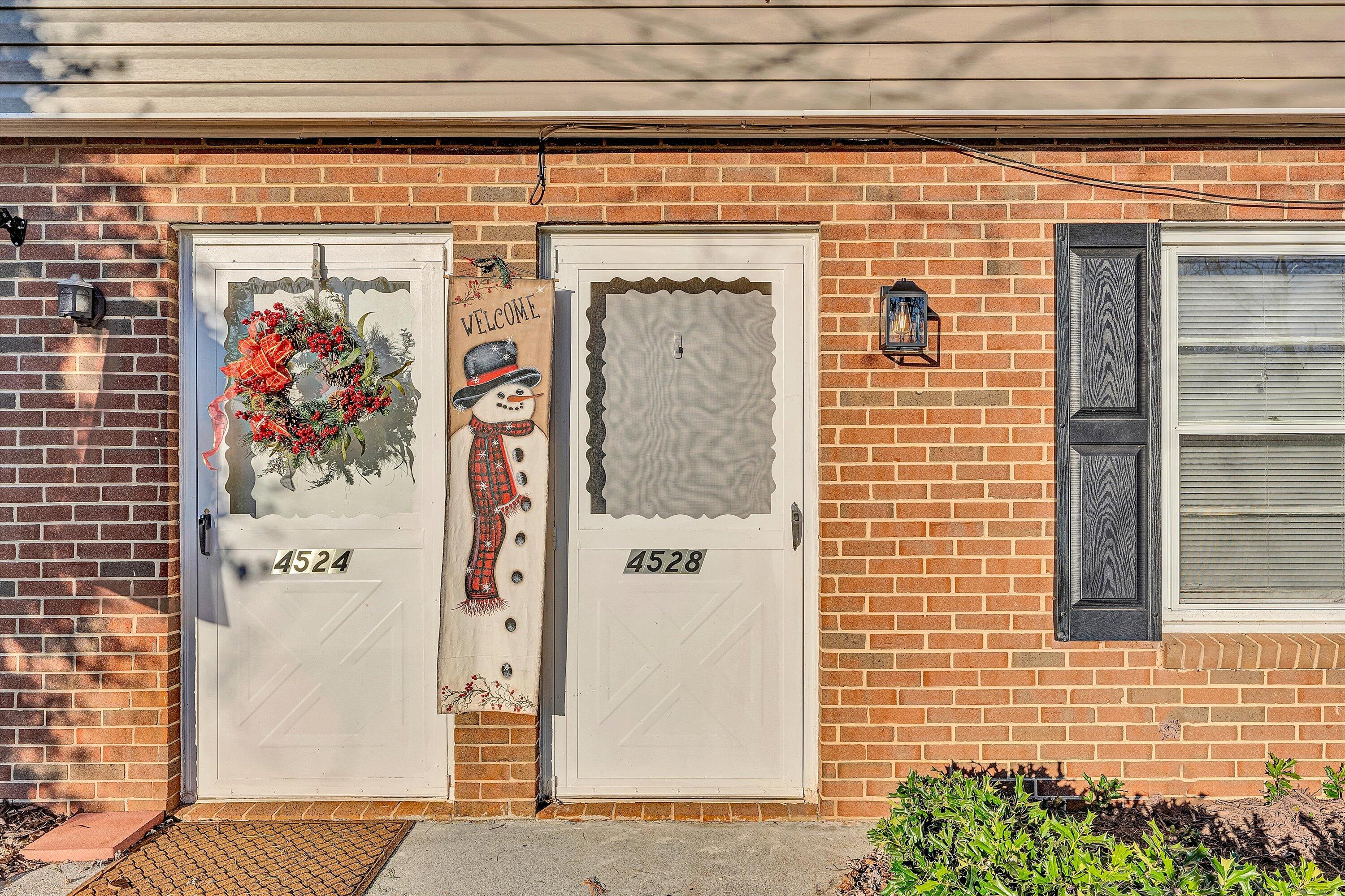 4524 Ohio Street Northeast, Unit 4528 Roanoke, VA 24019 - Photo 5 of 28 a front view of a building with a door and a window