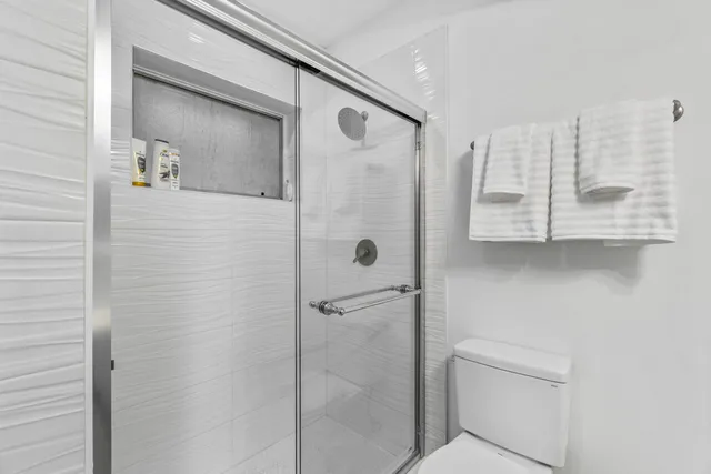 a bathroom with a shower and a sink