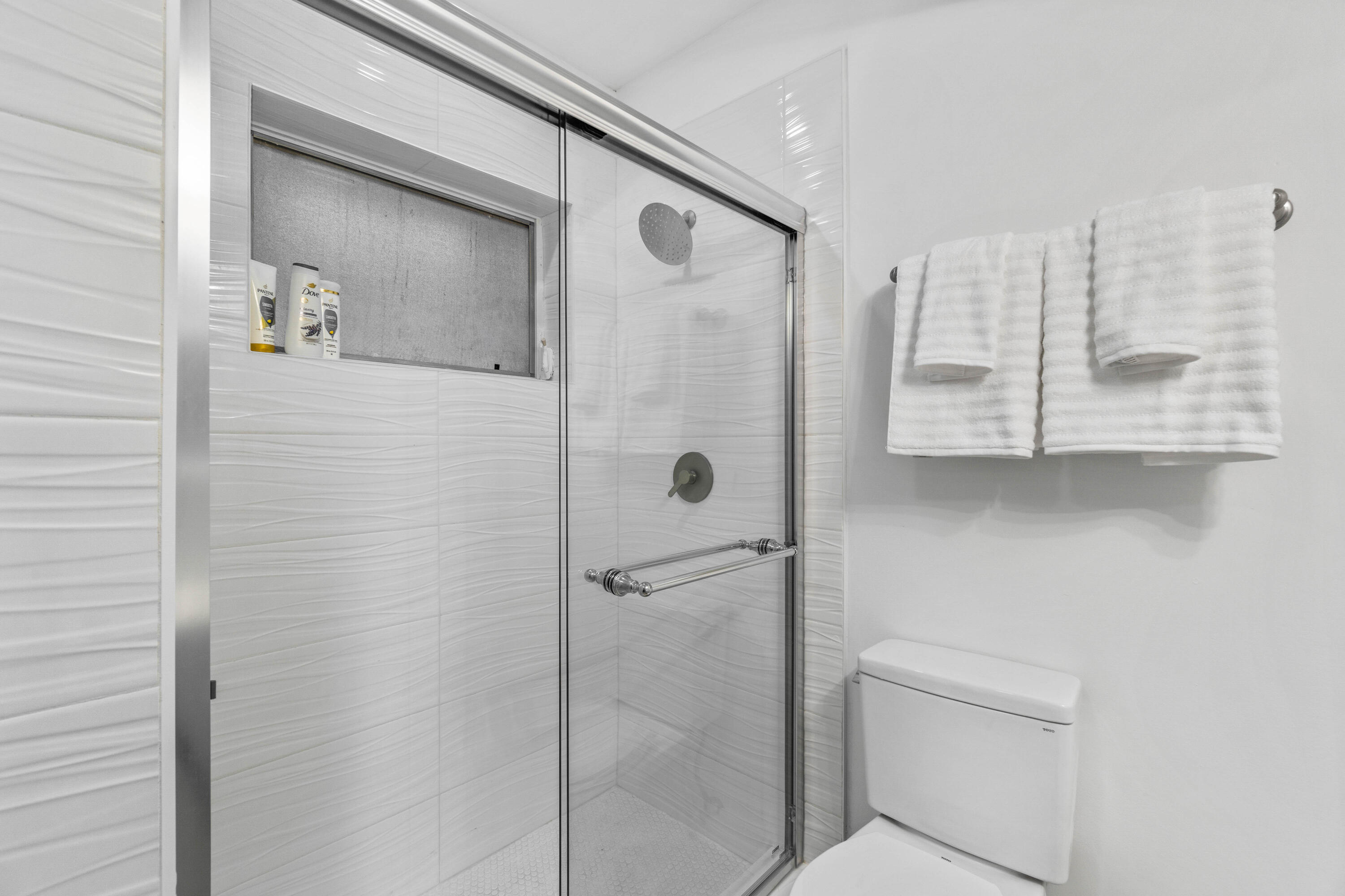1191 South Ocean Boulevard, Unit 6 Delray Beach, FL 33483 - Photo 11 of 19 a bathroom with a shower and a sink