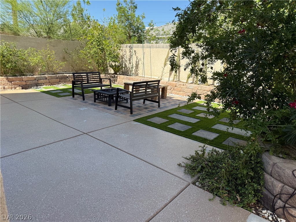 1141 Cathedral Ridge Street Henderson, NV 89052 - Photo 71 of 77 This private yard provides an inviting outdoor space for relaxation and enjoyment.