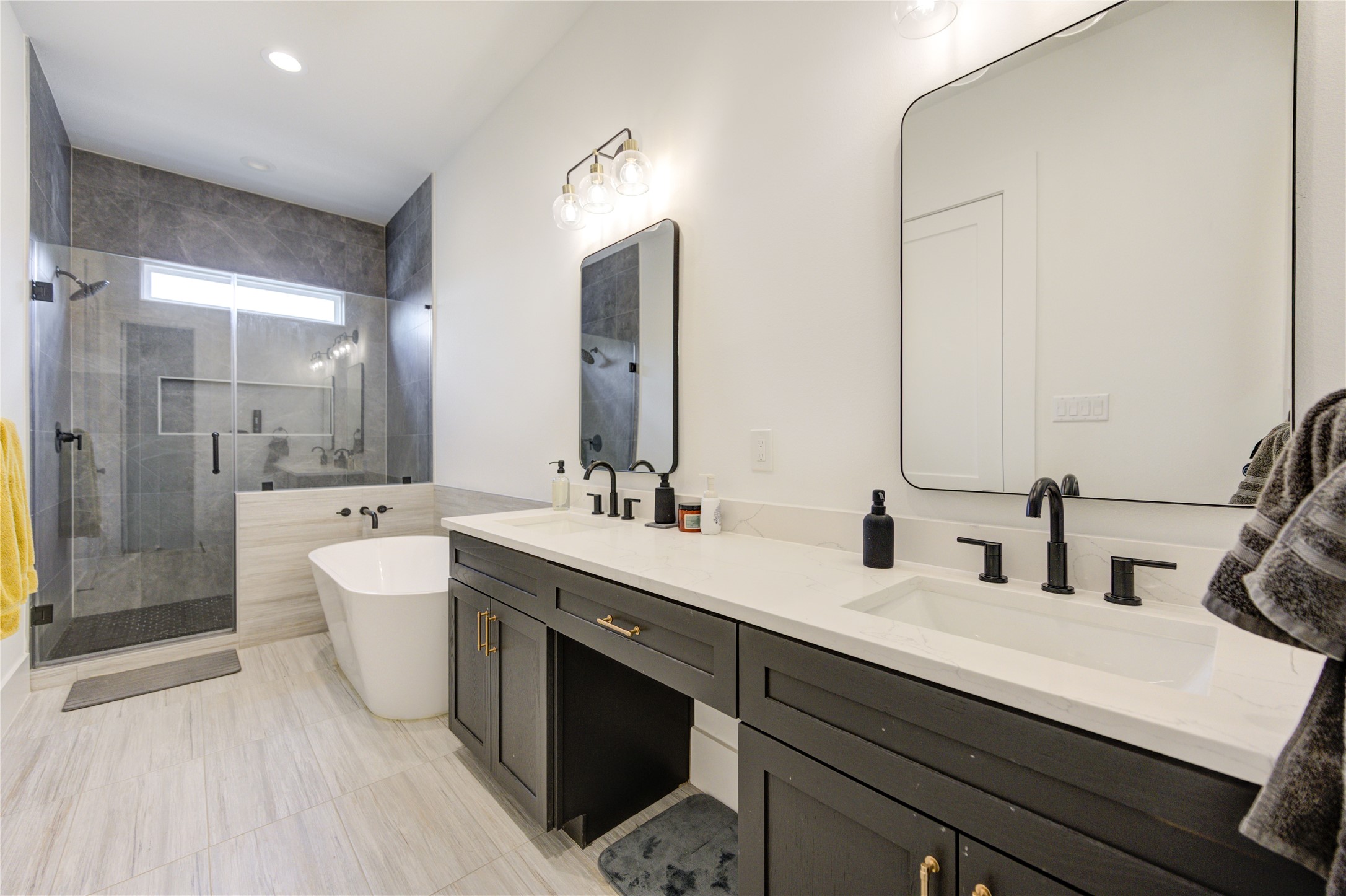 18 Sidney Street, Unit A Houston, TX 77003 - Photo 18 of 30 a bathroom with a double vanity sink mirror and shower