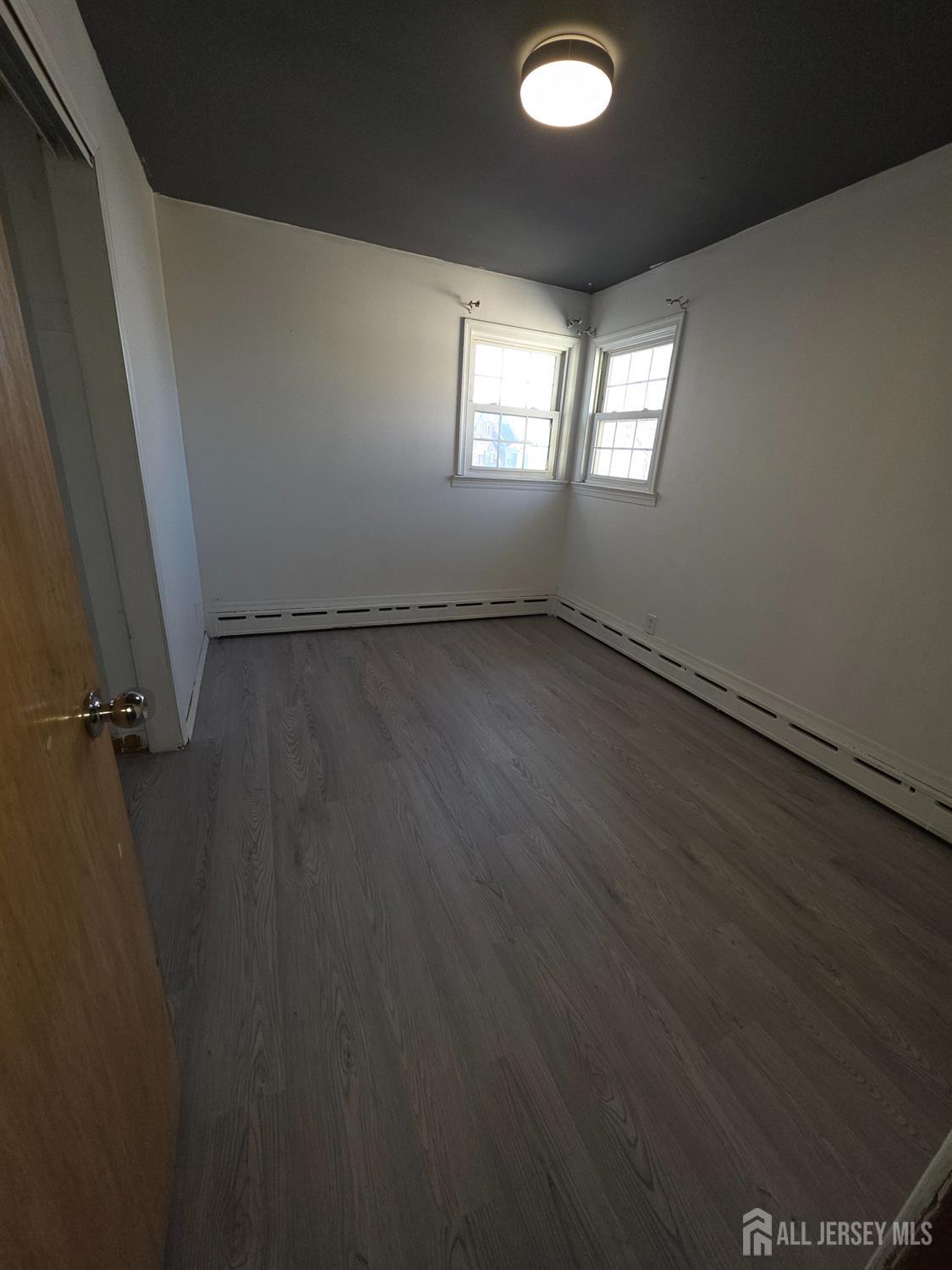 11 Post Boulevard Carteret, NJ 07008 - Photo 20 of 23 a view of an empty room with a window