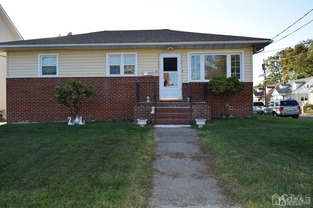 11 Post Boulevard Carteret, NJ 07008 - Photo 2 of 23 a front view of house with a garden