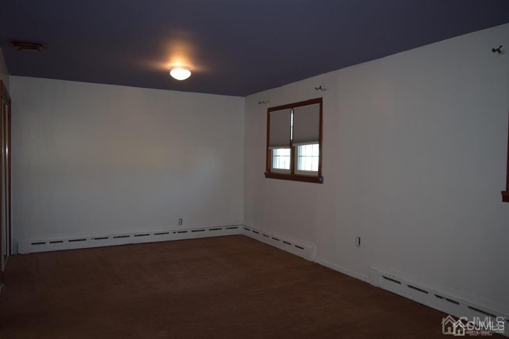 11 Post Boulevard Carteret, NJ 07008 - Photo 23 of 23 an empty room with a window
