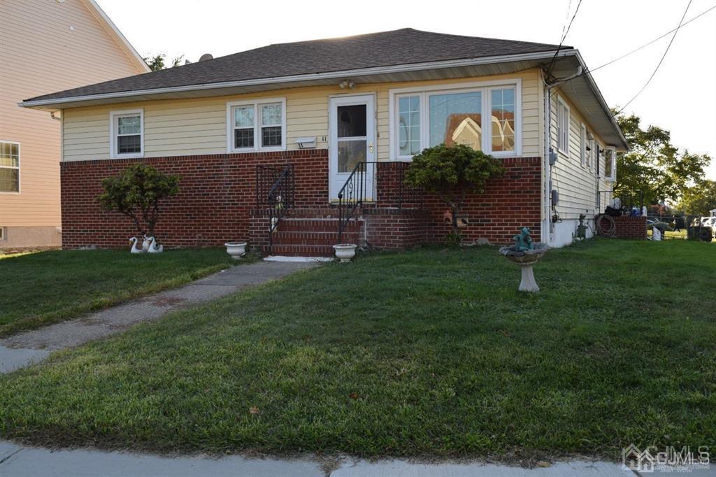 11 Post Boulevard Carteret, NJ 07008 - Photo 3 of 23 a front view of house with yard and green space