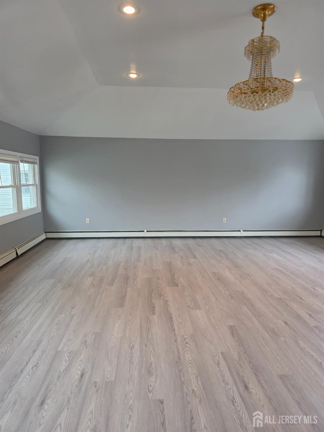 11 Post Boulevard Carteret, NJ 07008 - Photo 7 of 23 a view of a room with wooden floor and window