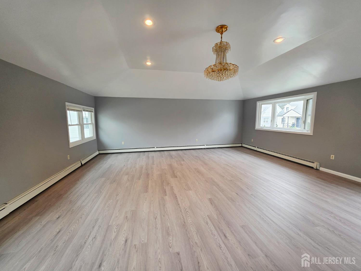 11 Post Boulevard Carteret, NJ 07008 - Photo 8 of 23 an empty room with wooden floor and windows