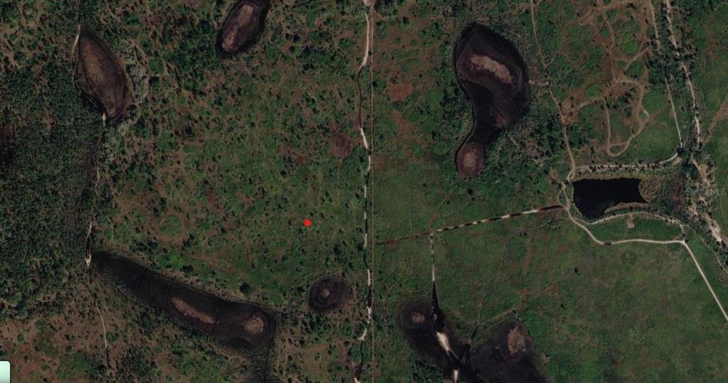 0 River Ranch Boulevard Lake Wales, FL 33867 - Photo 1 of 5 a backyard of a house with lots of green space and a lake view