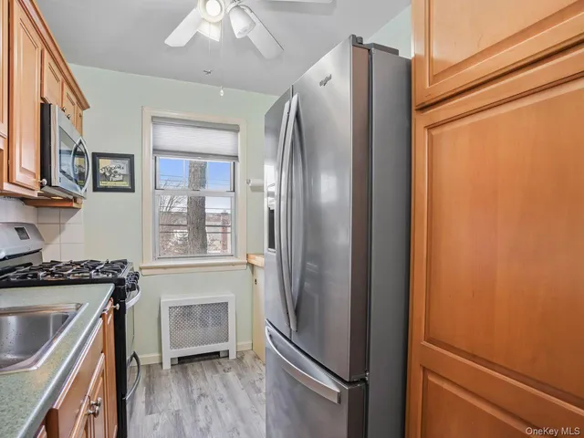 a bathroom with a sink a mirror a bathtub and shower