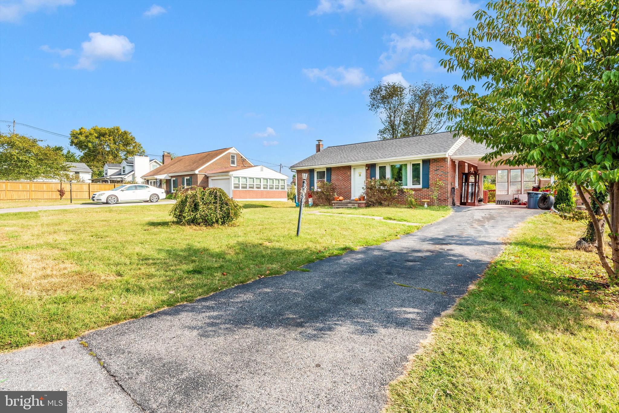 21 Harvard Road Hagerstown, MD 21742 - Photo 1 of 10 a front view of a house with a yard and lake view