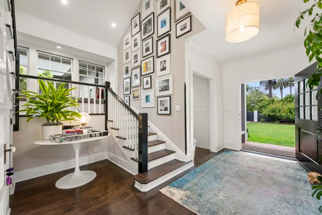 a spacious bathroom with a granite countertop sink toilet and a mirror