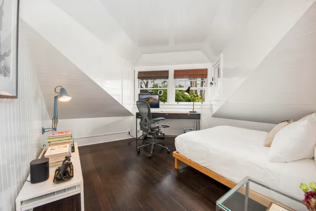 a outdoor dining space with furniture and potted plants