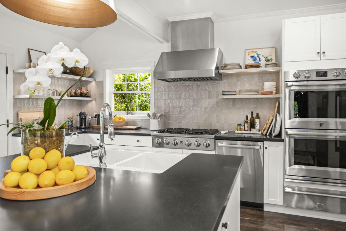71 Eucalyptus Lane Montecito, CA 93108 - Photo 4 of 69 a kitchen with stainless steel appliances granite countertop a stove a sink and a microwave