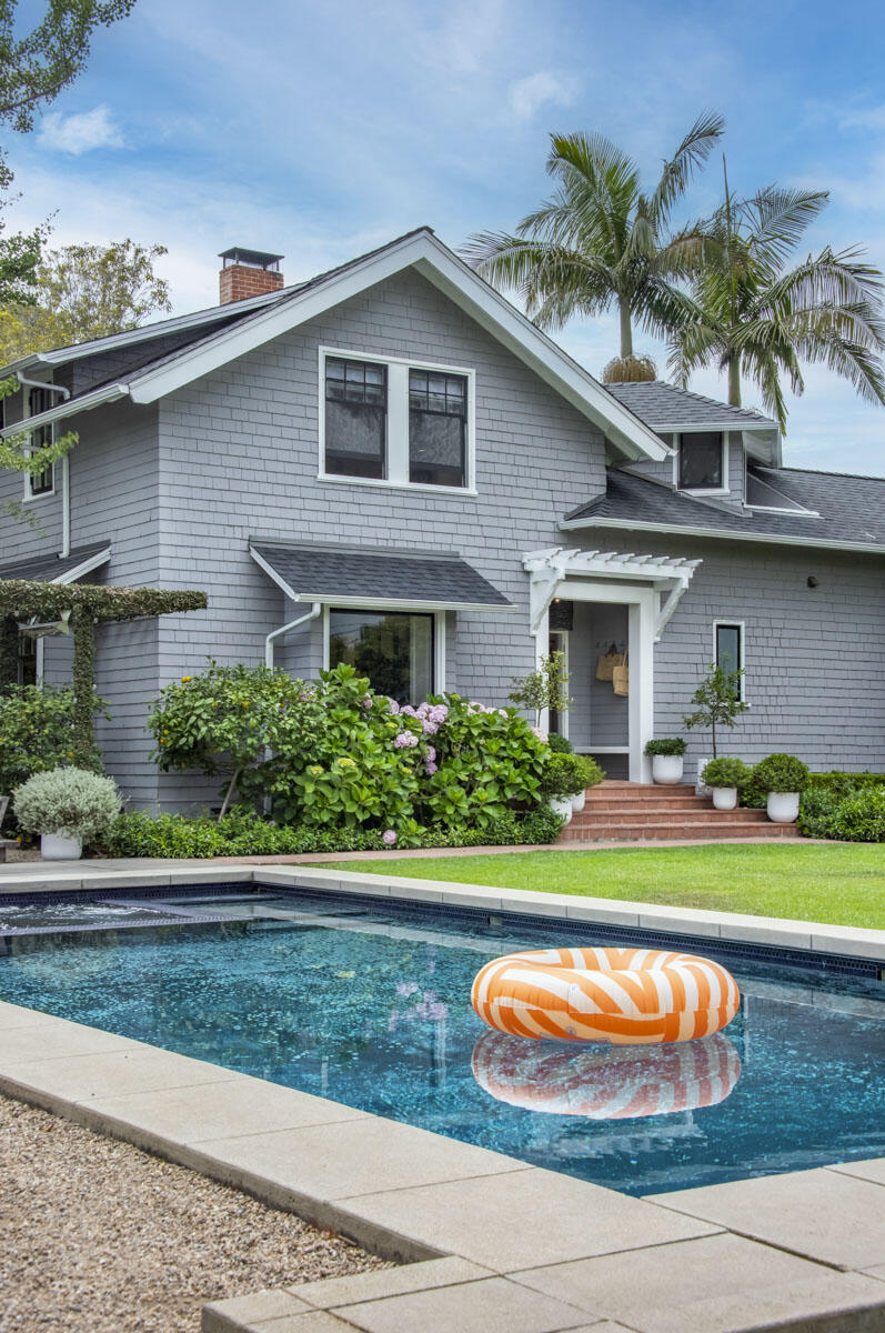 71 Eucalyptus Lane Montecito, CA 93108 - Photo 63 of 69 a front view of a house with a yard and potted plants