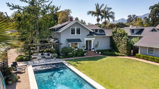 a view of a patio with couches a table and chairs