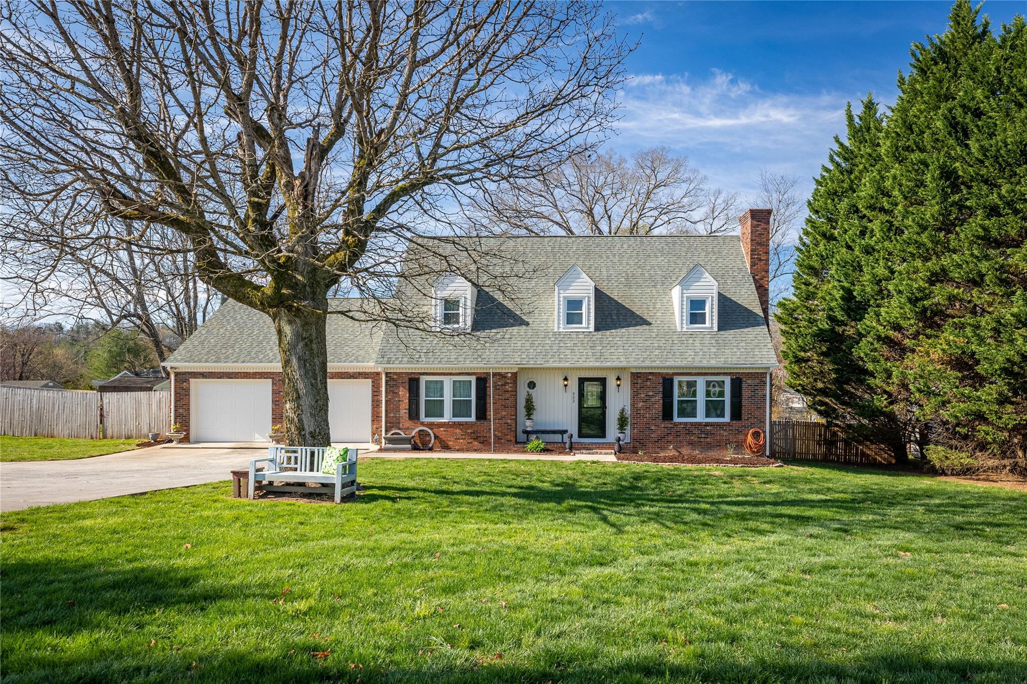 902 Bethel Road Morganton, NC 28655 - Photo 1 of 26 a front view of a house with a garden and trees