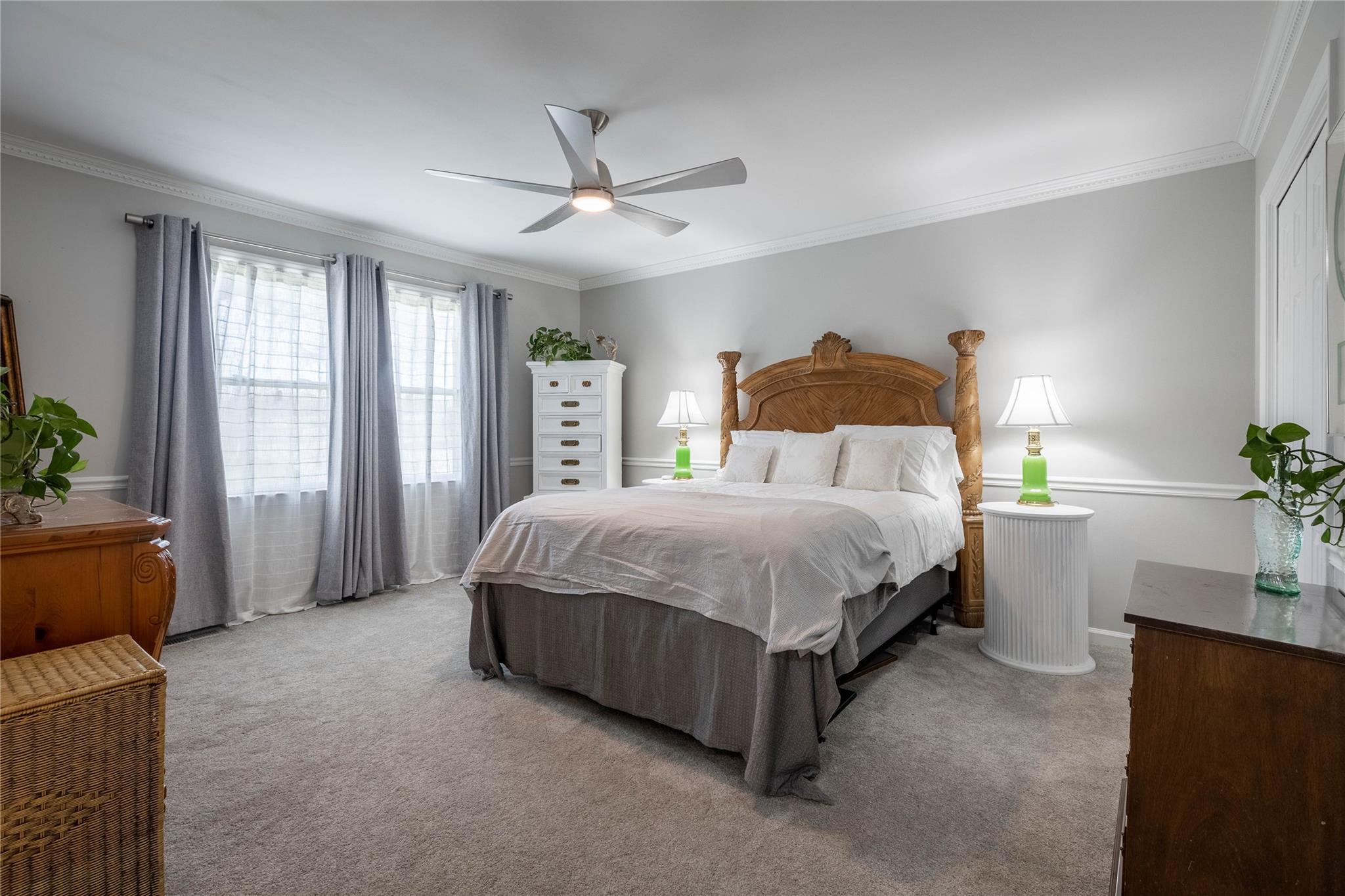 902 Bethel Road Morganton, NC 28655 - Photo 12 of 26 a spacious bedroom with a bed and a potted plant