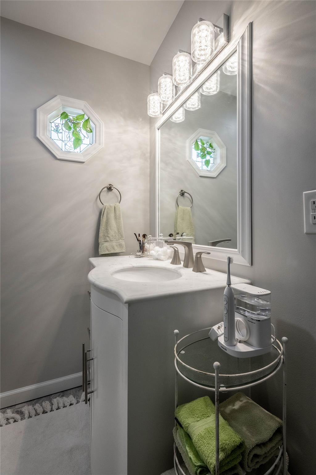 902 Bethel Road Morganton, NC 28655 - Photo 14 of 26 a bathroom with a sink and mirror