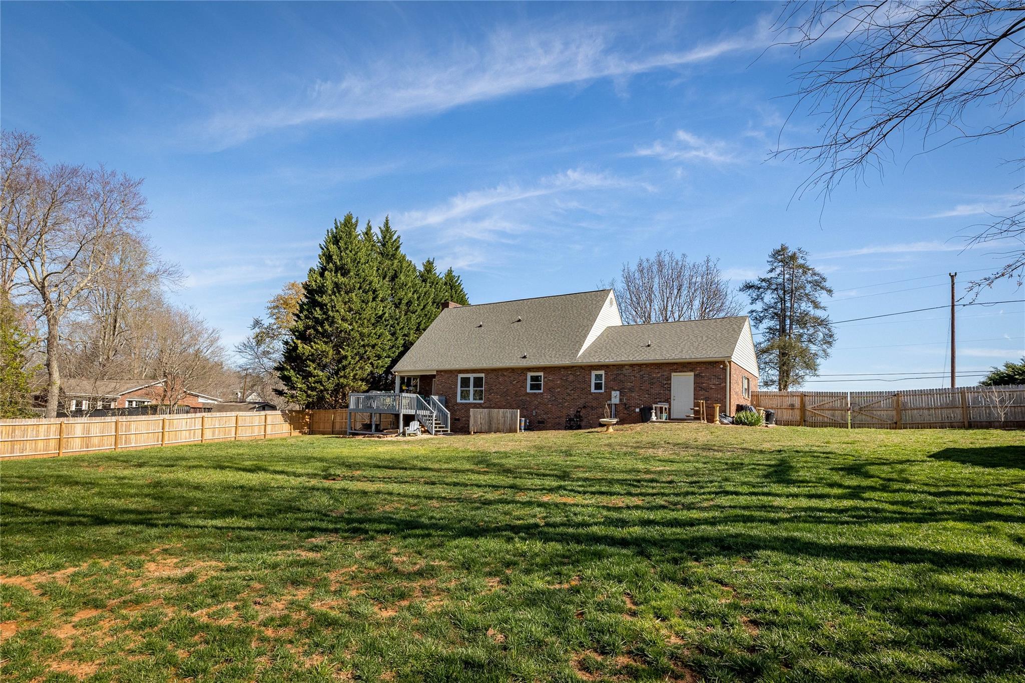 902 Bethel Road Morganton, NC 28655 - Photo 22 of 26 a house view with a sitting space garden and trees in the background