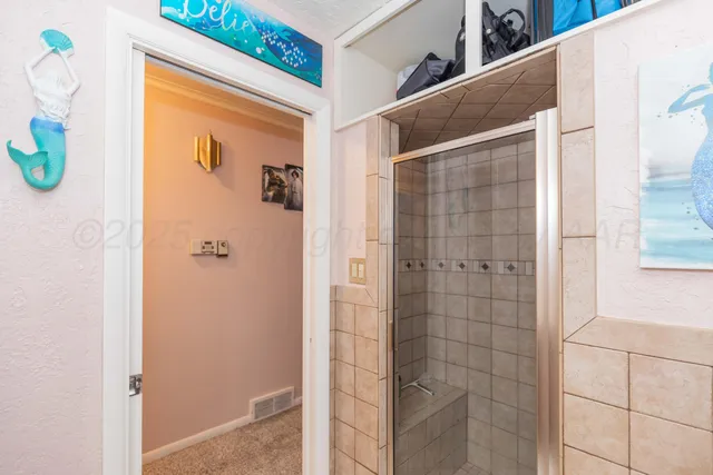 a bathroom with a sink mirror vanity and toilet