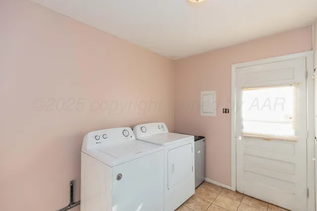 a view of walk in closet with clothes