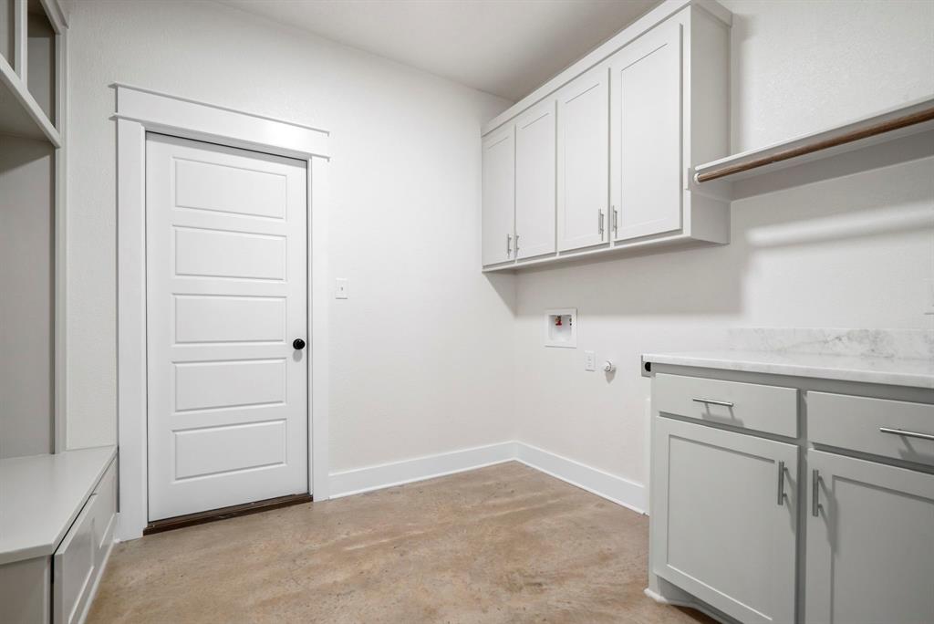 484 Clark Lake Road Weatherford, TX 76088 - Photo 11 of 21 a view of cabinets and utility room with closet