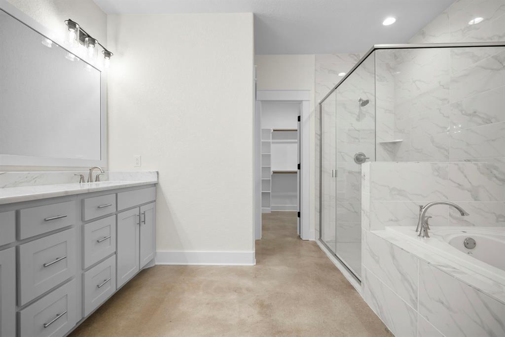 484 Clark Lake Road Weatherford, TX 76088 - Photo 14 of 21 a bathroom with a tub sink double vanity and mirrors