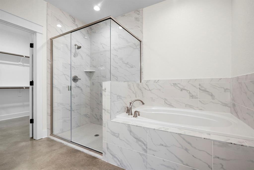 484 Clark Lake Road Weatherford, TX 76088 - Photo 15 of 21 a bathroom with a bathtub and a shower