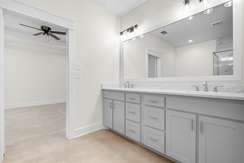 484 Clark Lake Road Weatherford, TX 76088 - Photo 16 of 21 a bathroom with double vanity sink and a mirror