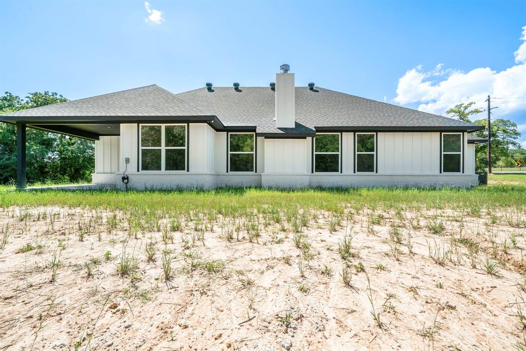 484 Clark Lake Road Weatherford, TX 76088 - Photo 5 of 21 a front view of a house with garden
