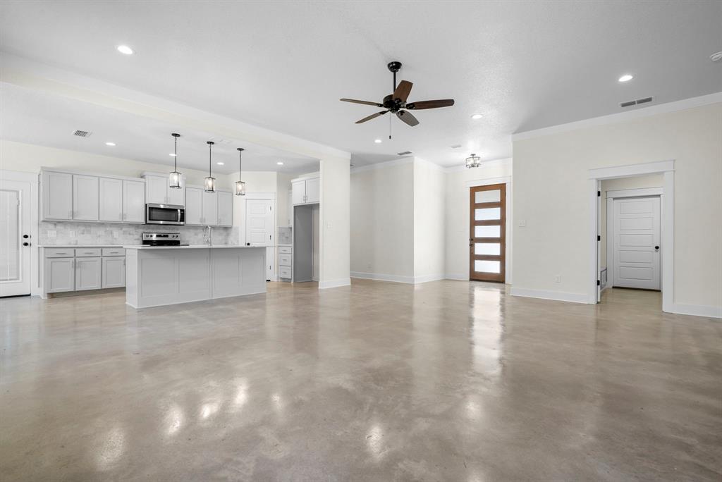 484 Clark Lake Road Weatherford, TX 76088 - Photo 7 of 21 a view of a kitchen with a sink and a stove top oven