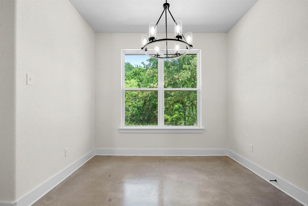 484 Clark Lake Road Weatherford, TX 76088 - Photo 8 of 21 a room with a window and a chandelier