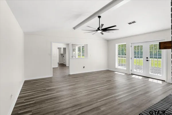 a kitchen with a refrigerator sink and stainless steel appliances