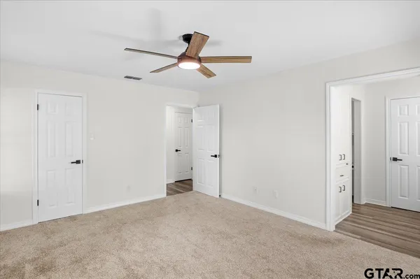 a bathroom with a tub and a shower