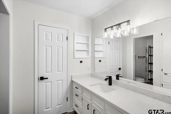 a view of a house with backyard and porch