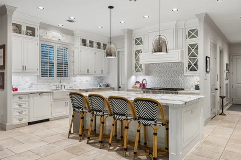 a dining room with furniture and a floor to ceiling window
