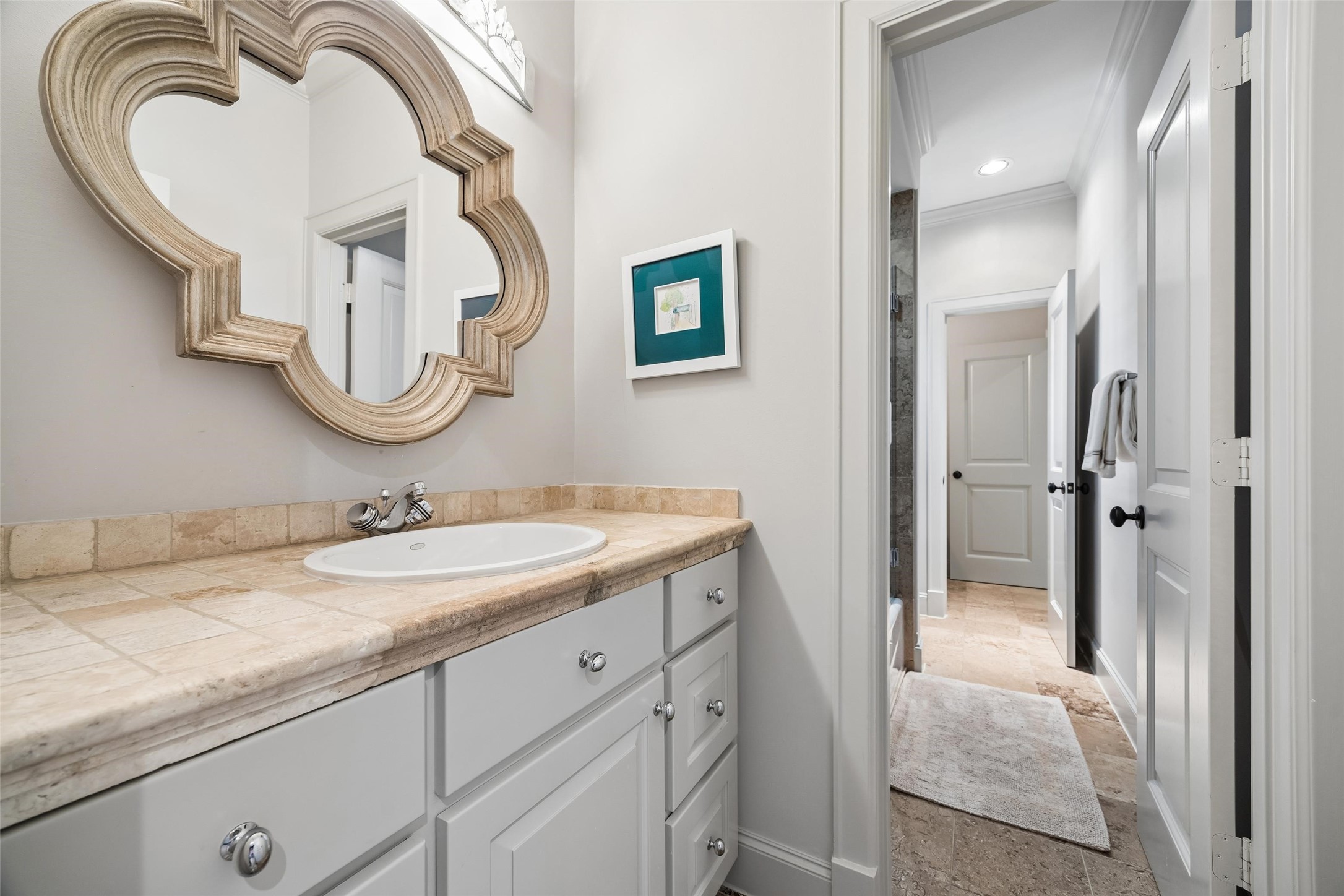 422 Pinewold Drive Houston, TX 77056 - Photo 34 of 49 a en suite bathroom with a granite countertop sink and a mirror