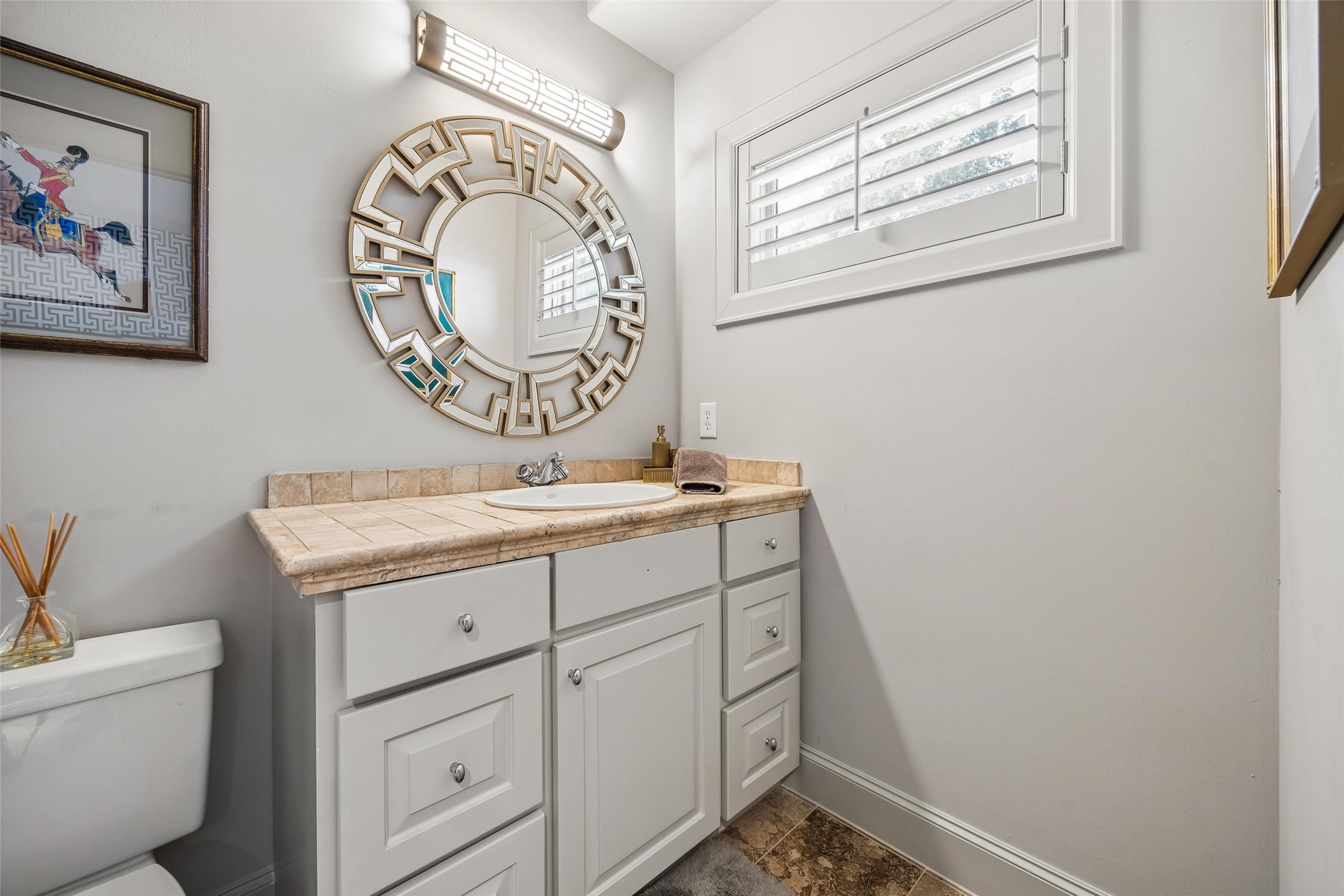 422 Pinewold Drive Houston, TX 77056 - Photo 36 of 49 a bathroom with a granite countertop sink and a mirror