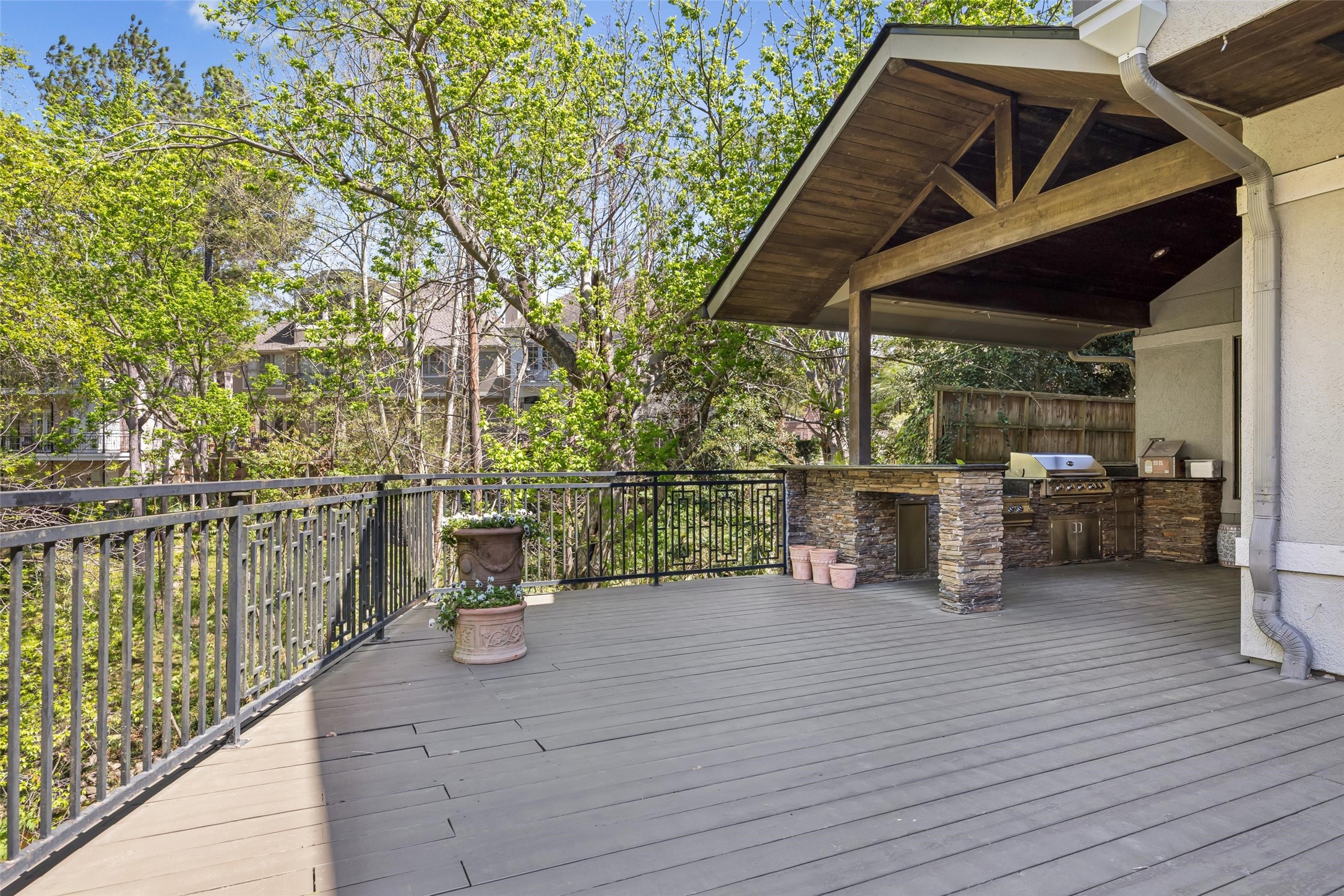 422 Pinewold Drive Houston, TX 77056 - Photo 41 of 49 a view of a patio with table and chairs with wooden floor and fence