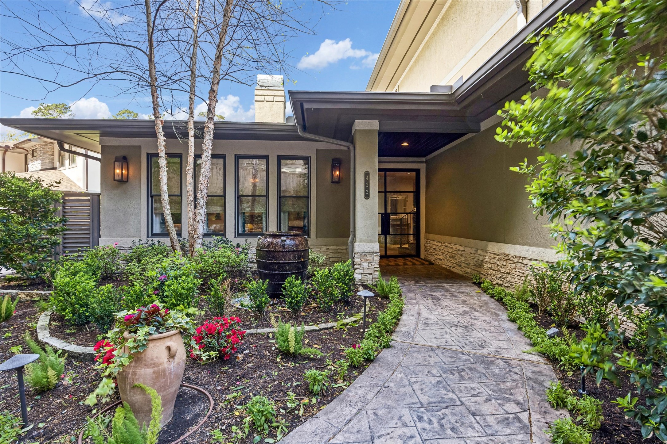422 Pinewold Drive Houston, TX 77056 - Photo 47 of 49 a view of a house that has a flower garden