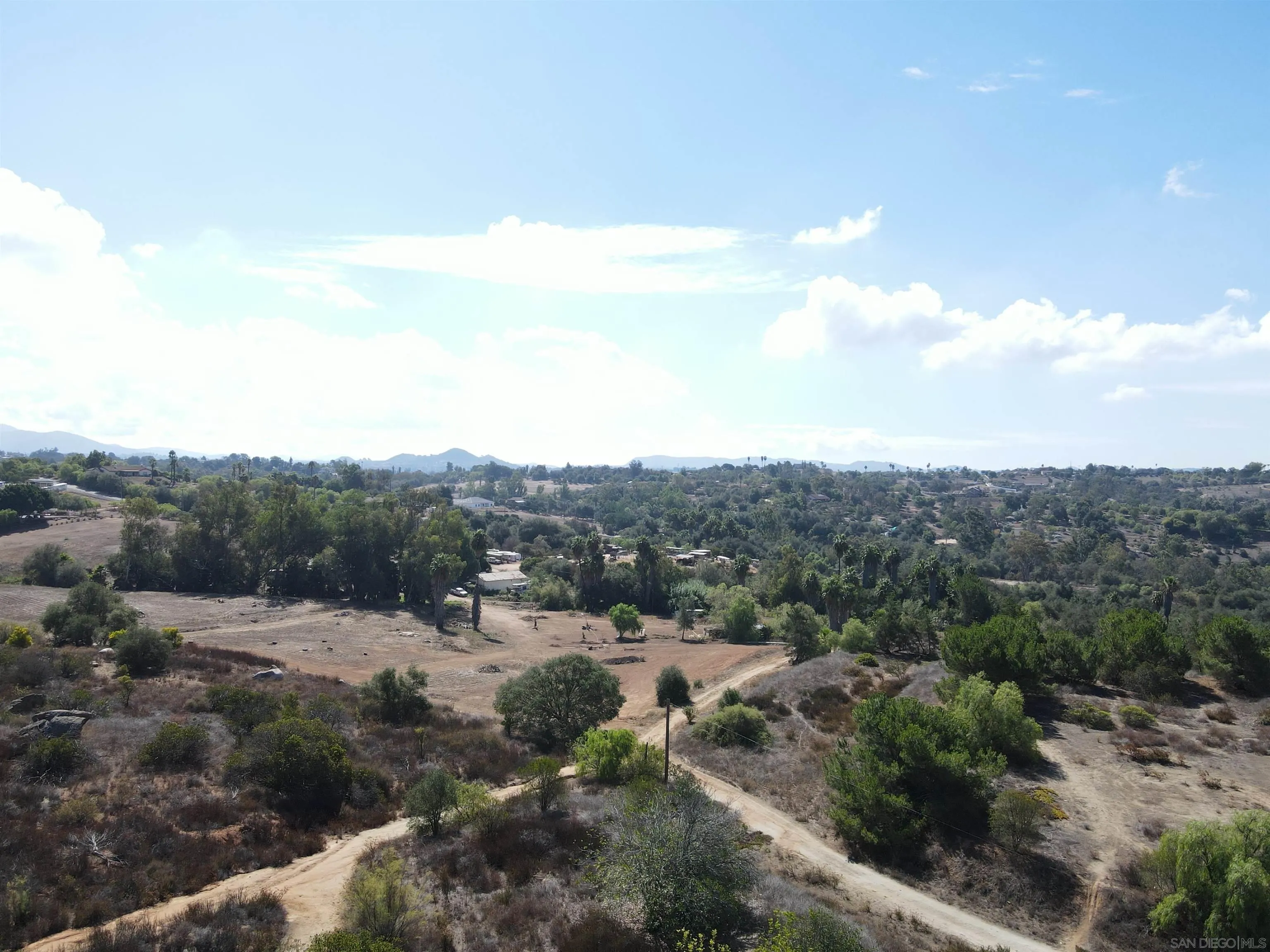 77.78-ac Jeffrey Heights Road Valley Center, CA 92082 - Photo 11 of 14 a view of a forest with mountains in the background