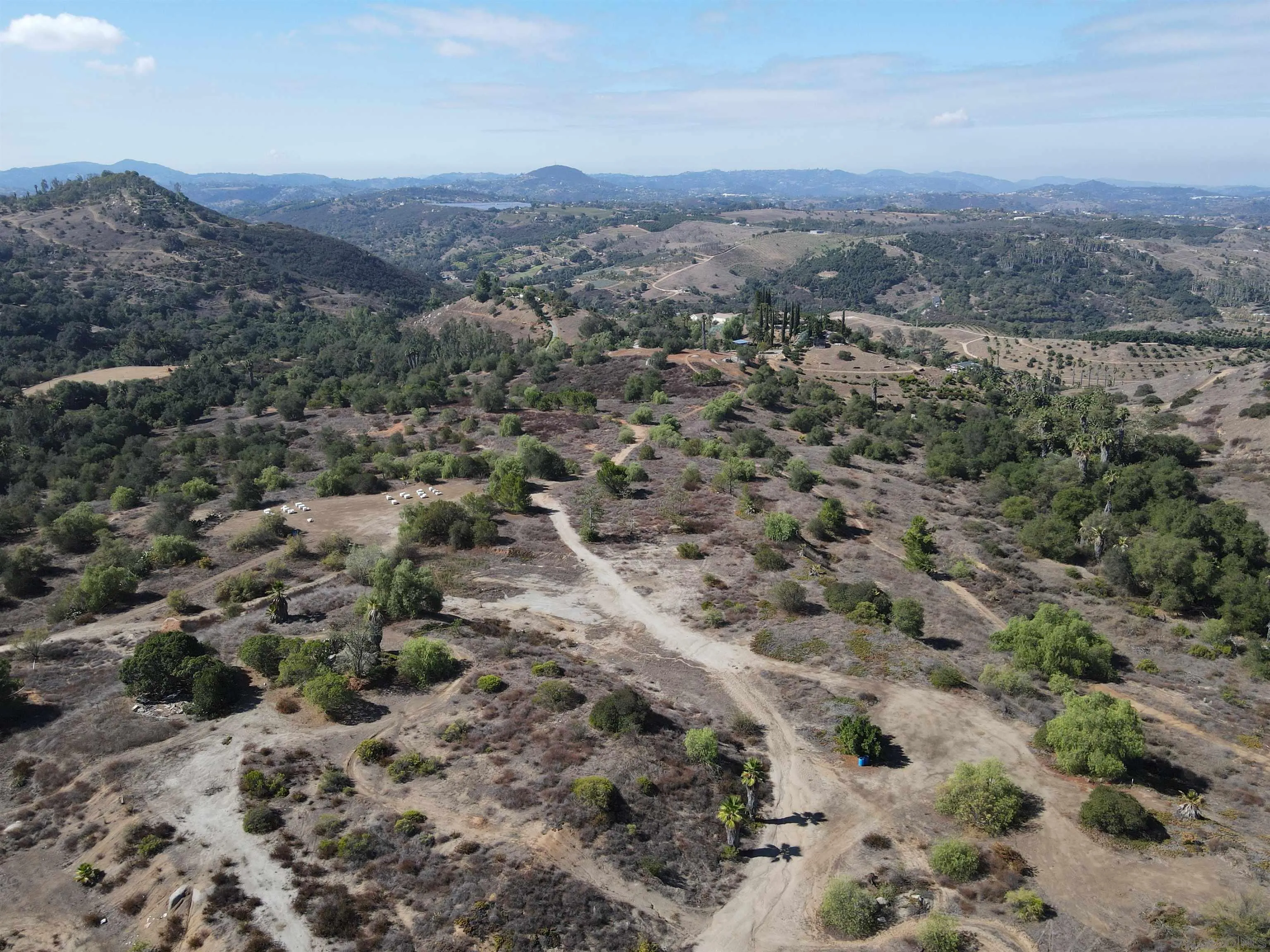 77.78-ac Jeffrey Heights Road Valley Center, CA 92082 - Photo 2 of 14 a view of a city with mountains in the background