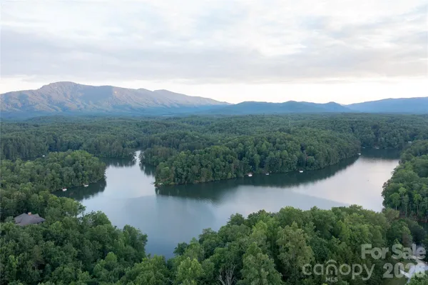 an aerial view of mountain with lake view