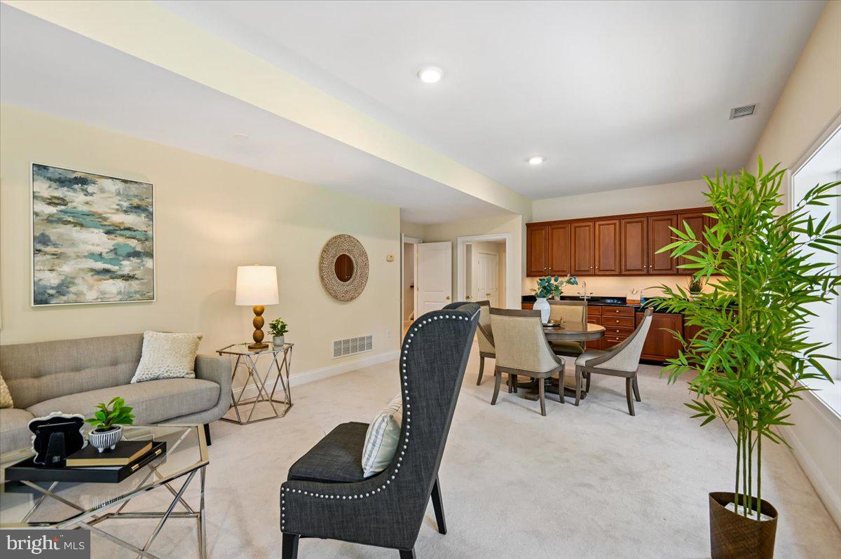 2700 Falling Timber Trail Edgewater, MD 21037 - Photo 53 of 89 a living room with furniture a potted plant and a large window